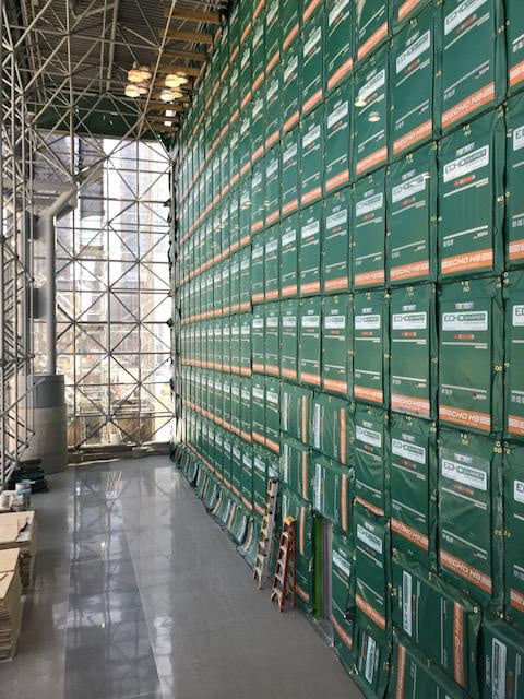 A vertical wall of Echo Barriers attached to scaffolding